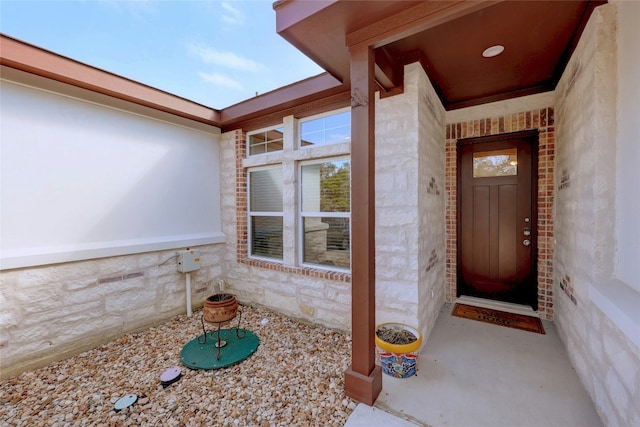 entrance to property with stone siding