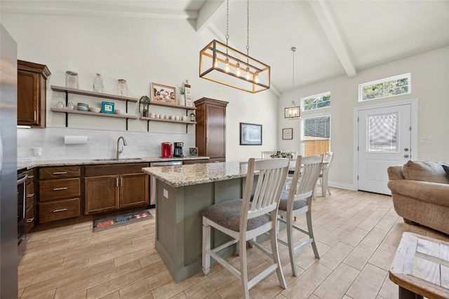 kitchen featuring tasteful backsplash, wood tiled floor, beam ceiling, and open shelves