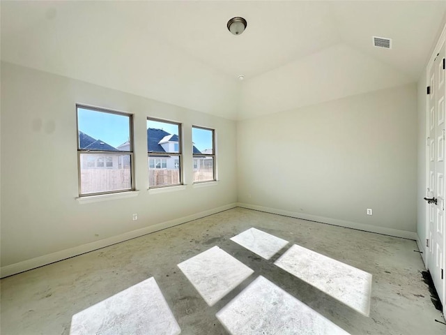 unfurnished bedroom with lofted ceiling, baseboards, and visible vents