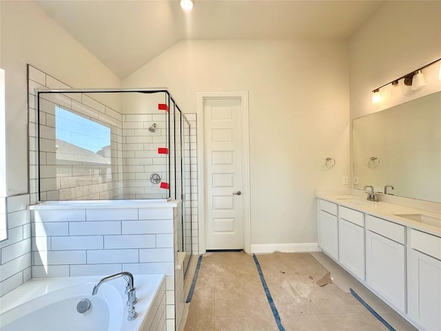 full bath with a garden tub, a sink, a shower stall, double vanity, and lofted ceiling