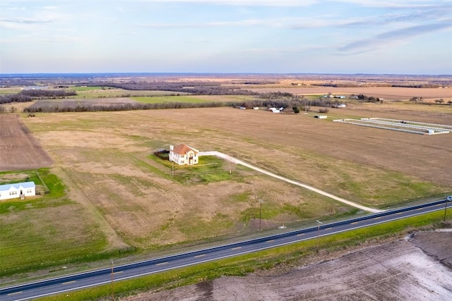 birds eye view of property with a rural view