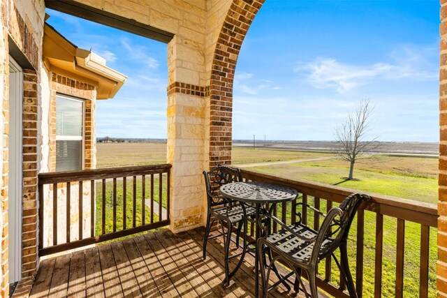 wooden terrace with a rural view