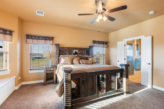 bedroom with carpet flooring, visible vents, and baseboards