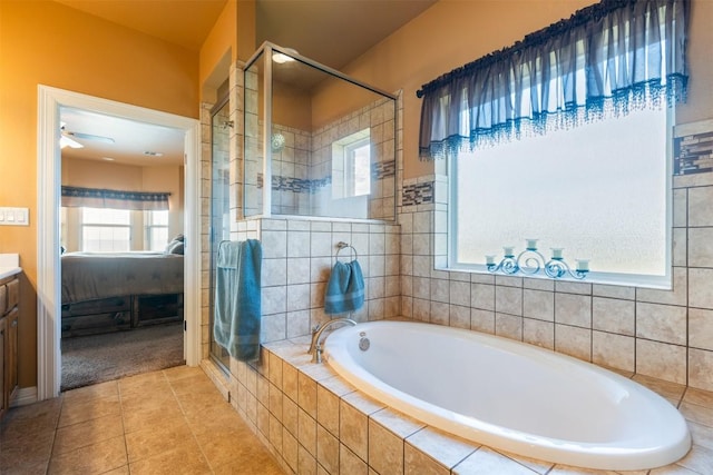 3622 N Fm 486, Thorndale, TX 76577 - ensuite bathroom featuring a stall shower, a garden tub, tile patterned floors, ceiling fan, and vanity