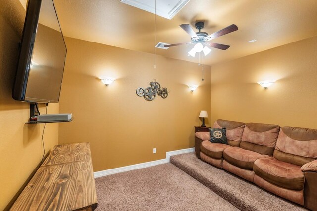 living room with attic access, visible vents, baseboards, a ceiling fan, and carpet