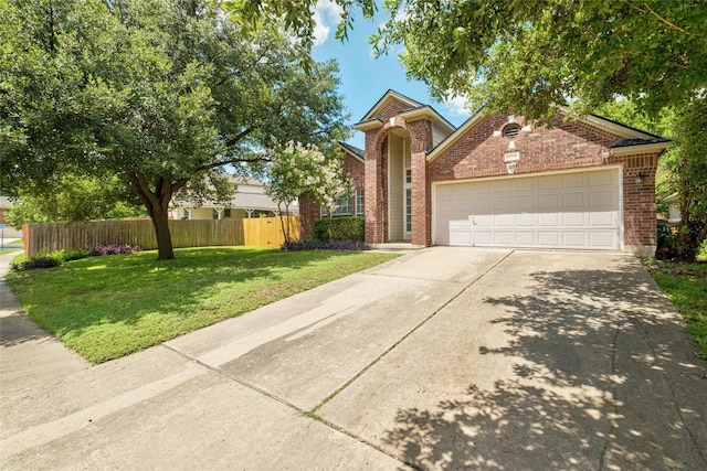 view of front of house with brick siding, fence, a garage, driveway, and a front lawn