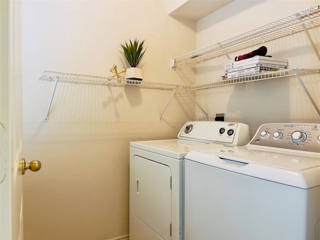 laundry area featuring laundry area and washing machine and clothes dryer