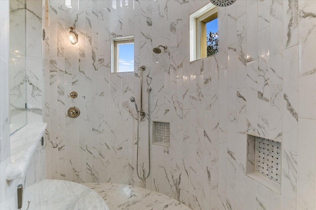 full bath with a marble finish shower