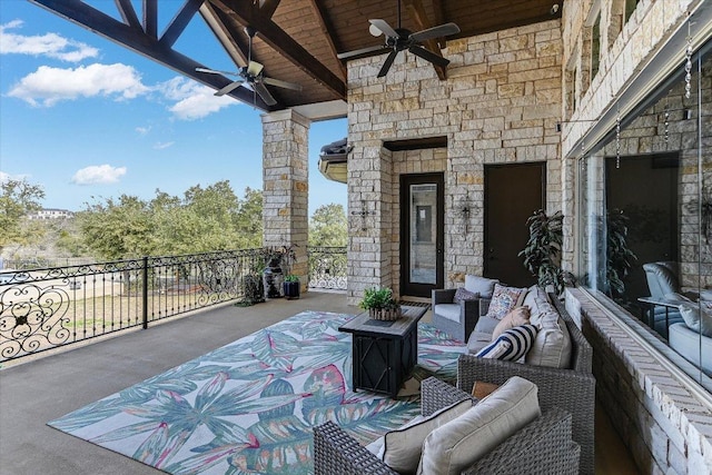 view of patio featuring ceiling fan, outdoor lounge area, and a balcony