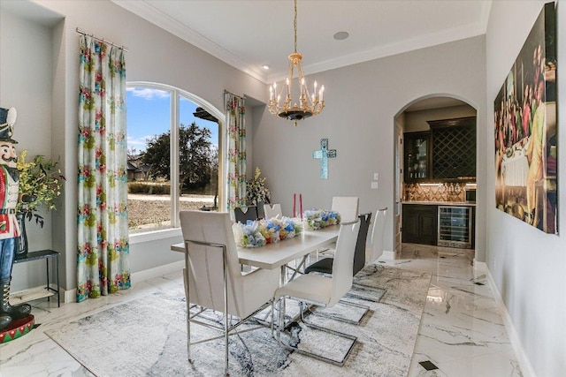 dining room featuring beverage cooler, marble finish floor, baseboards, and a healthy amount of sunlight