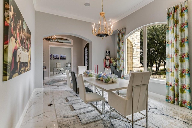 dining area featuring baseboards, arched walkways, ornamental molding, marble finish floor, and a chandelier