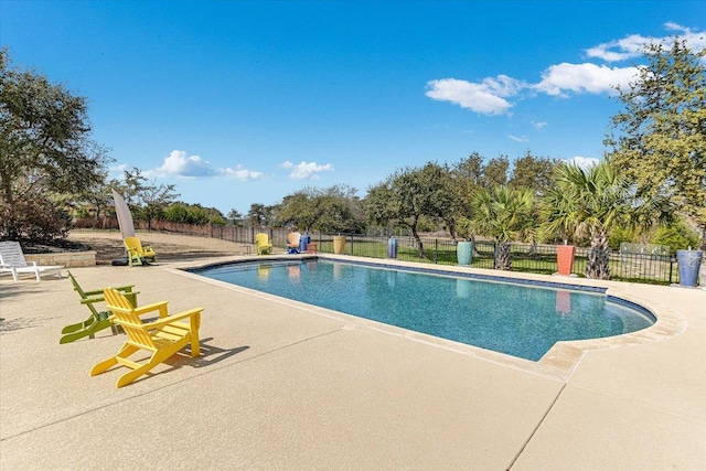 view of pool featuring fence, a fenced in pool, and a patio