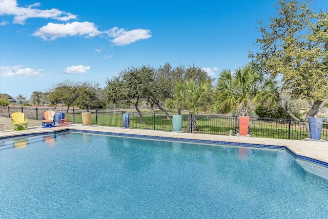 view of swimming pool with a fenced in pool and fence