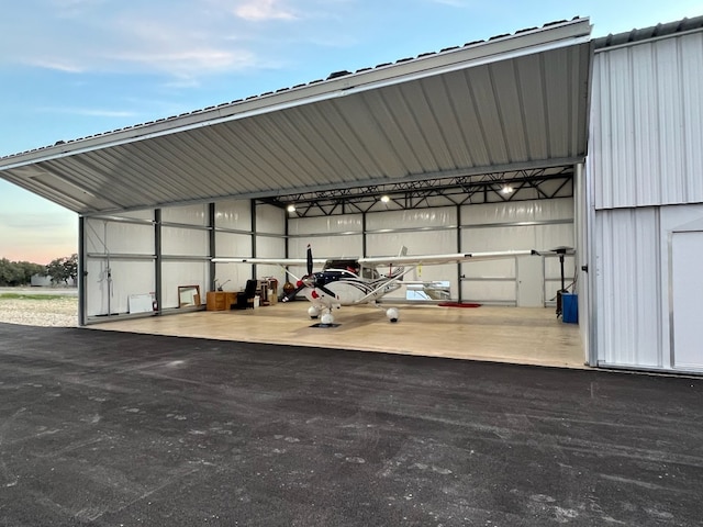 exterior space with a carport and an outbuilding