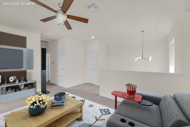 living room featuring carpet floors, recessed lighting, visible vents, baseboards, and ceiling fan with notable chandelier