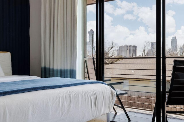 bedroom featuring a city view