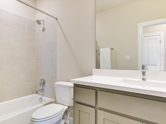 bathroom featuring  shower combination, vanity, and toilet