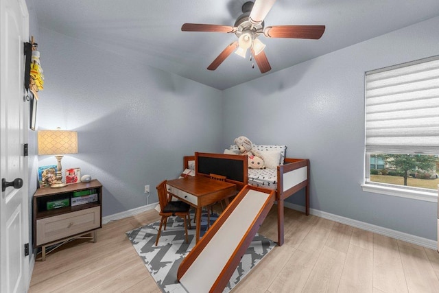 interior space featuring baseboards and wood finished floors