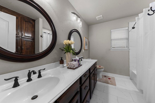 full bath featuring toilet, marble finish floor, visible vents, and a sink