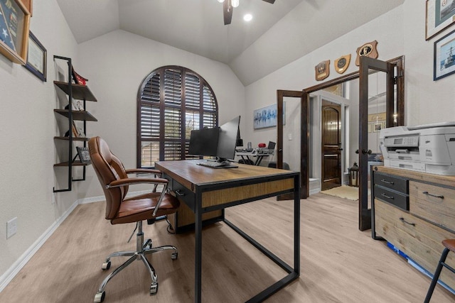 office area with vaulted ceiling, ceiling fan, light wood finished floors, and baseboards