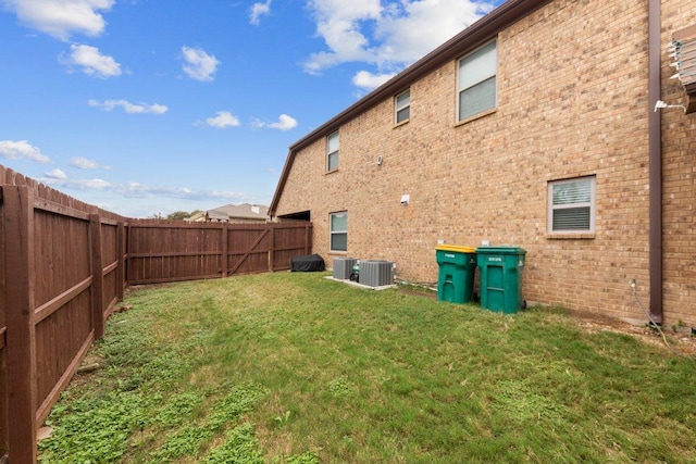 view of yard featuring a fenced backyard and cooling unit