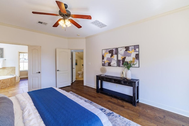 bedroom featuring ornamental molding, visible vents, and wood finished floors