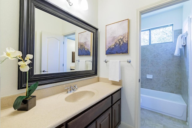 full bathroom featuring tile patterned flooring, shower / bathing tub combination, and vanity