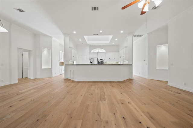 unfurnished living room with ornamental molding, recessed lighting, visible vents, and light wood-style flooring