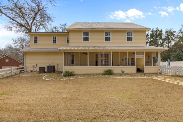 rear view of property with a sunroom, ceiling fan, fence, and central AC unit