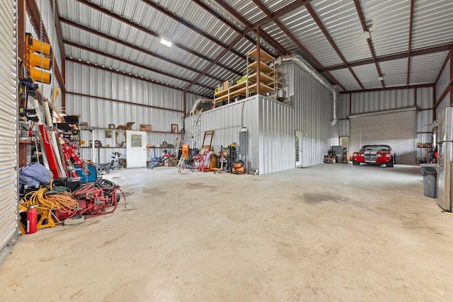 garage with metal wall and electric panel