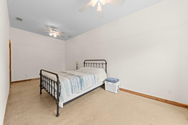 bedroom with baseboards, finished concrete floors, visible vents, and ceiling fan