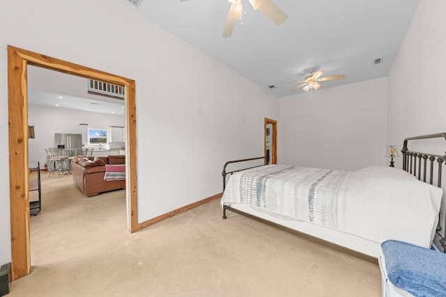 carpeted bedroom featuring a ceiling fan, visible vents, and baseboards