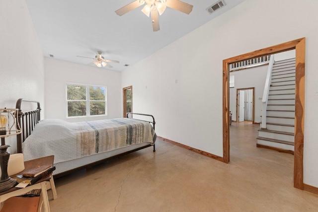 bedroom featuring a ceiling fan, concrete floors, visible vents, and baseboards