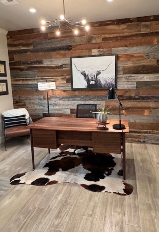 office space with wood walls and wood finished floors