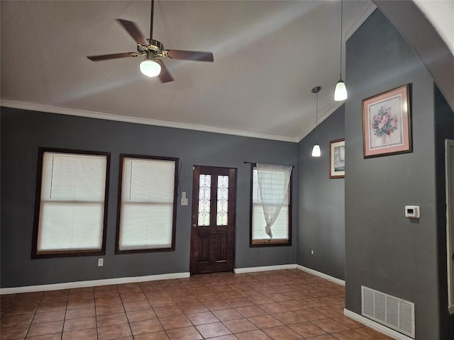 entrance foyer with lofted ceiling, baseboards, visible vents, and crown molding