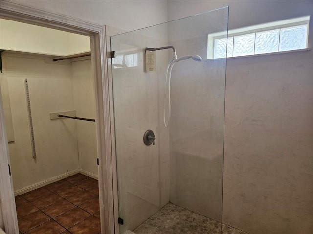 full bathroom featuring walk in shower and tile patterned floors