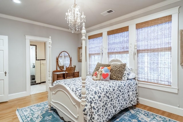 bedroom with baseboards, visible vents, ornamental molding, wood finished floors, and a notable chandelier