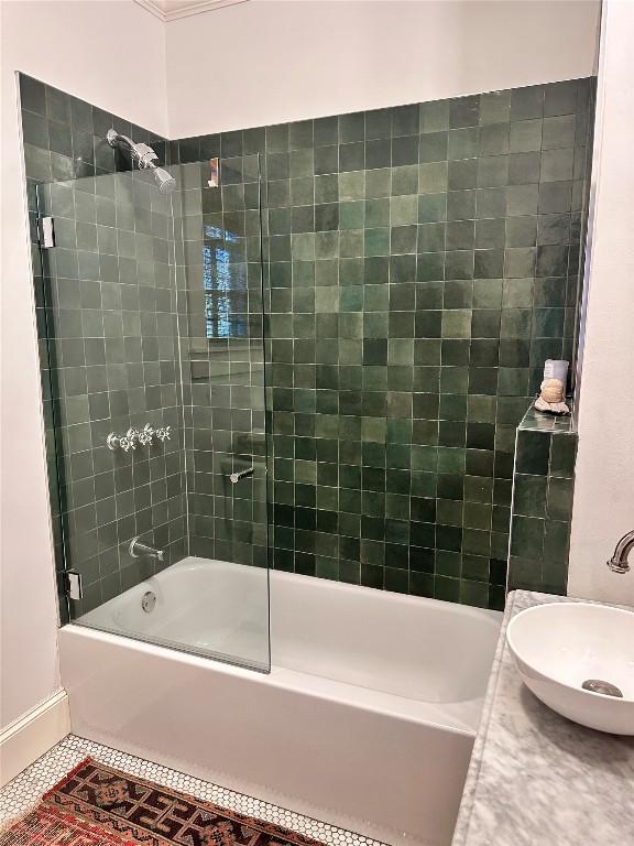 bathroom with bathtub / shower combination, a sink, and tile patterned floors