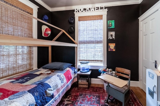 bedroom featuring ornamental molding and baseboards