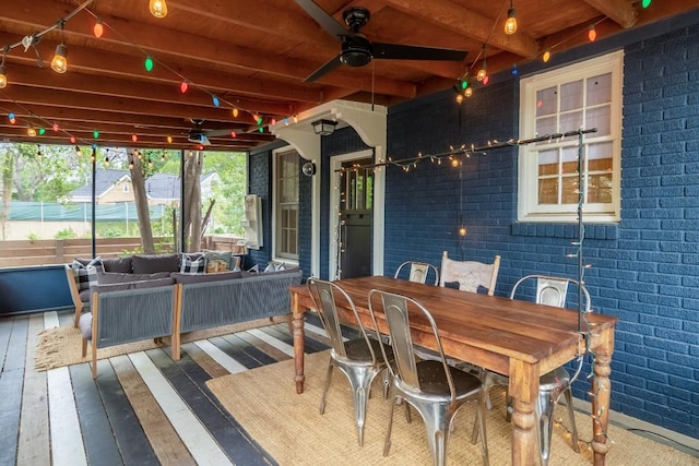 deck featuring an outdoor living space, outdoor dining space, and a ceiling fan