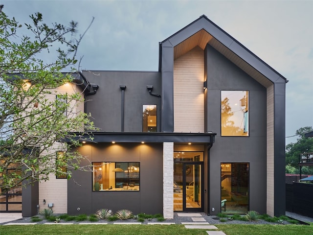 contemporary home featuring stucco siding