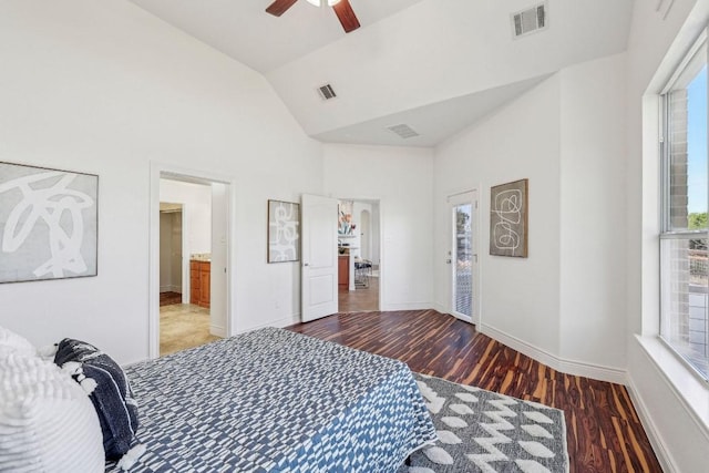 bedroom featuring wood finished floors, visible vents, and baseboards