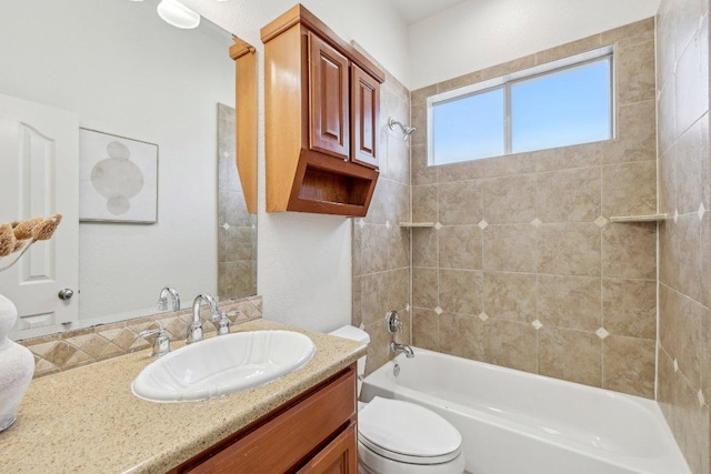 bathroom with shower / washtub combination, vanity, and toilet