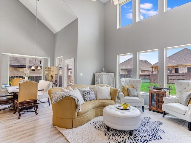 living room with light wood-style floors and a healthy amount of sunlight