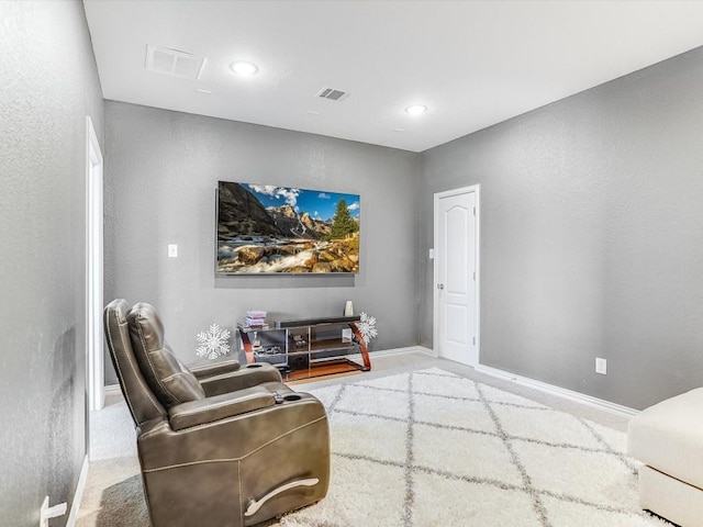 sitting room with carpet floors, recessed lighting, visible vents, and baseboards