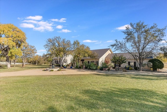 exterior space featuring a yard and driveway