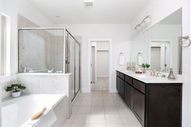 1409 Kneehigh Ln, Georgetown, TX 78633 - full bath with a bath, a shower stall, double vanity, and tile patterned flooring