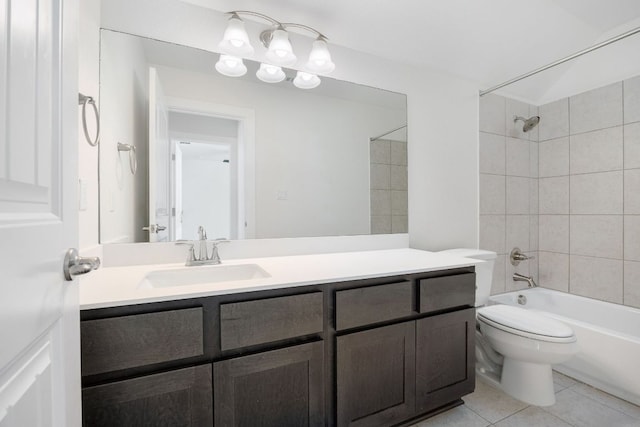 bathroom with washtub / shower combination, tile patterned flooring, vanity, and toilet