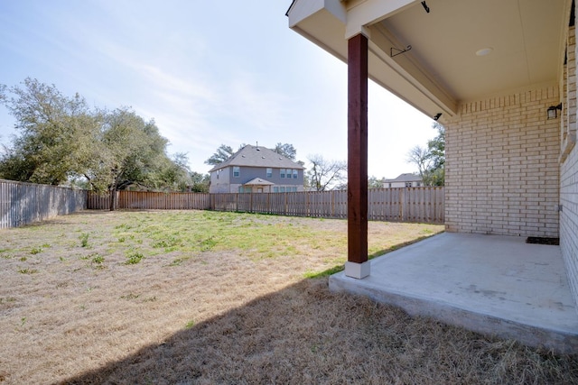 view of yard with a patio and a fenced backyard