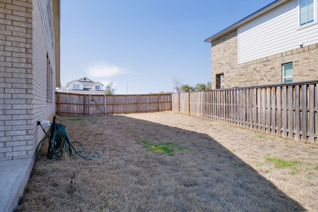 view of yard featuring a fenced backyard